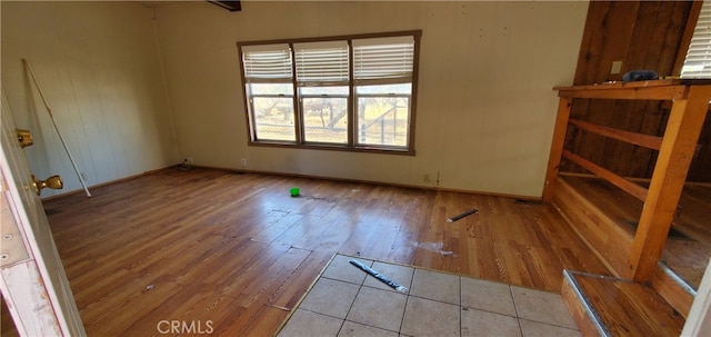 empty room with wood-type flooring