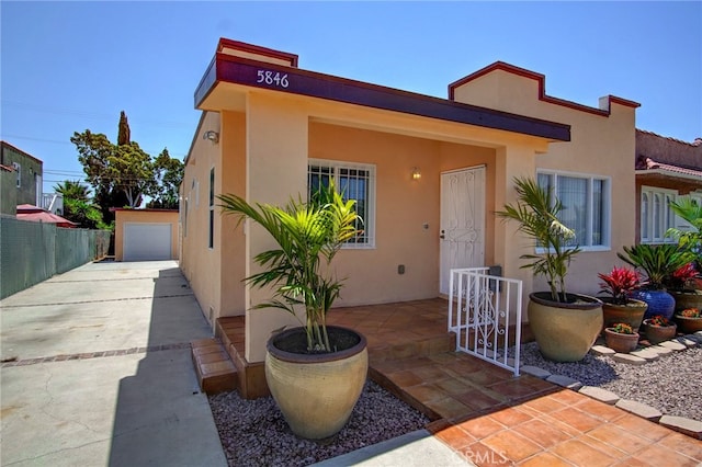 view of front of house with an outdoor structure and a garage