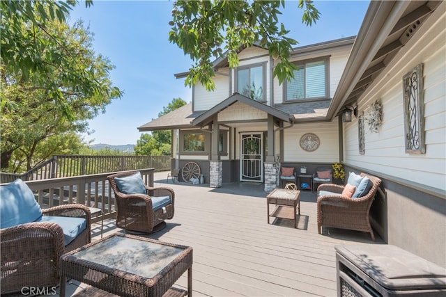 wooden deck featuring outdoor lounge area