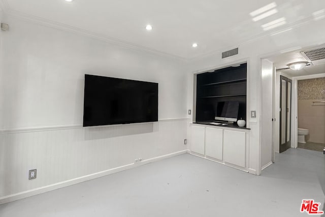 unfurnished living room featuring crown molding