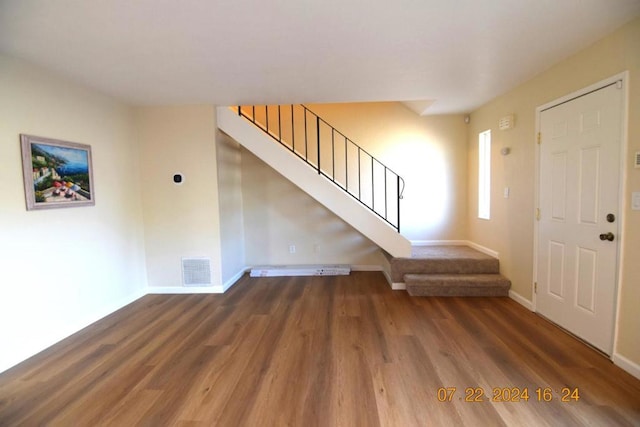 entryway featuring dark wood-type flooring