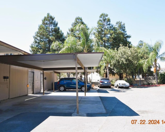 view of vehicle parking featuring a carport