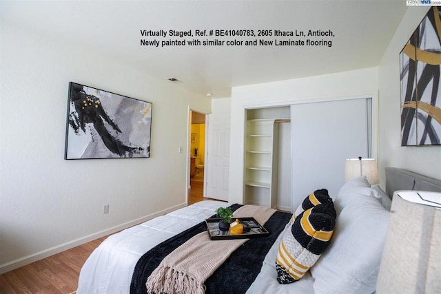 bedroom featuring hardwood / wood-style flooring and a closet