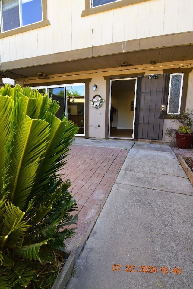 property entrance featuring a patio area