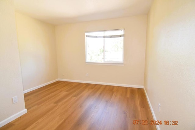 spare room featuring light hardwood / wood-style floors