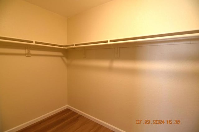 walk in closet featuring wood-type flooring