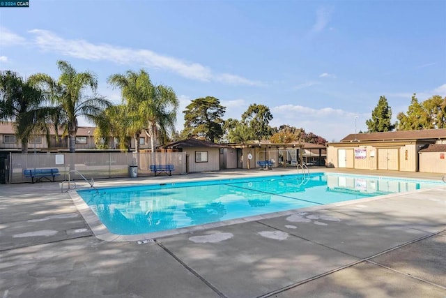 view of swimming pool with a patio area