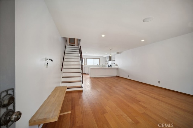 unfurnished living room featuring light hardwood / wood-style flooring