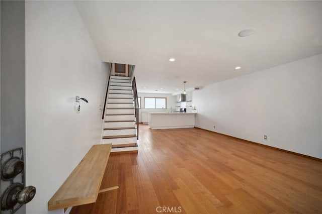 unfurnished living room with light hardwood / wood-style flooring