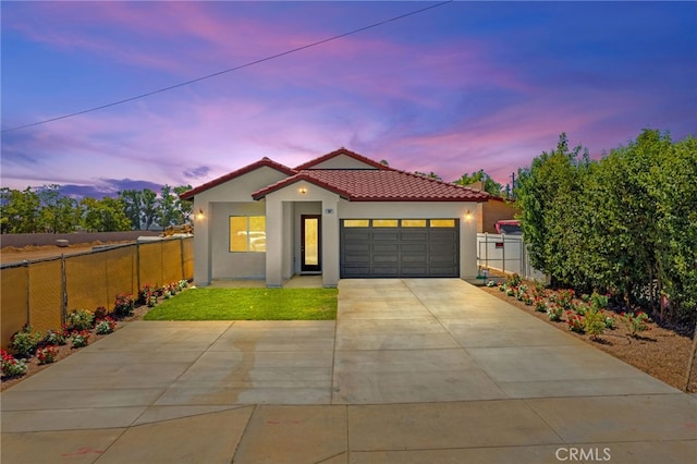 mediterranean / spanish-style house featuring a garage