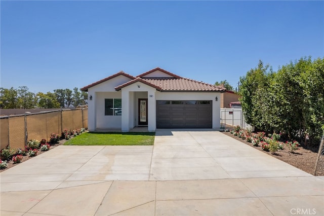 mediterranean / spanish-style home featuring a garage