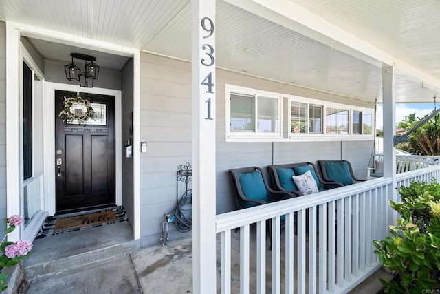 doorway to property featuring covered porch