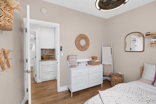 bedroom with hardwood / wood-style floors