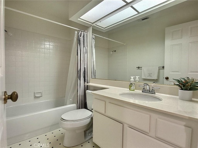 full bath featuring toilet, a skylight, vanity, visible vents, and shower / bath combo with shower curtain