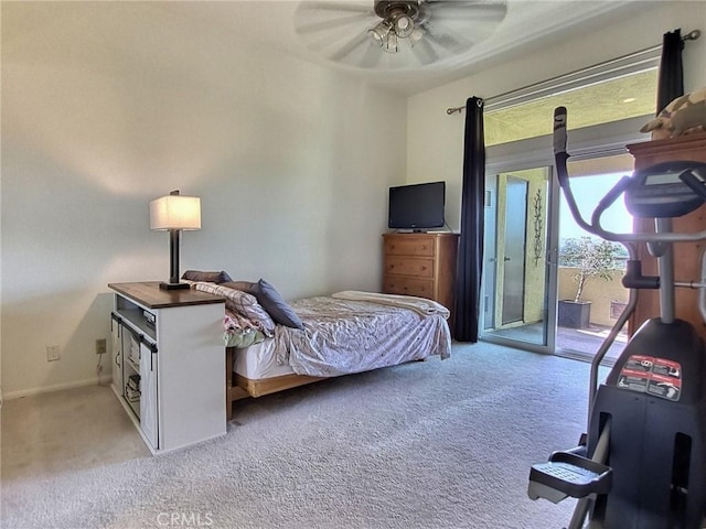 carpeted bedroom featuring access to exterior, ceiling fan, and baseboards