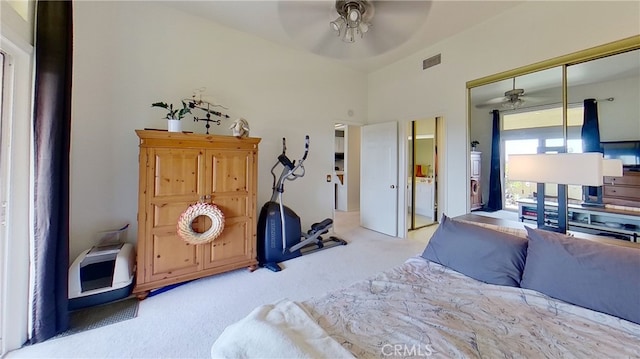 carpeted bedroom with a ceiling fan, visible vents, and a closet