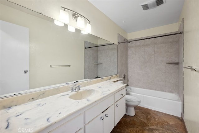 full bathroom featuring toilet, tile patterned floors, vanity, and tiled shower / bath