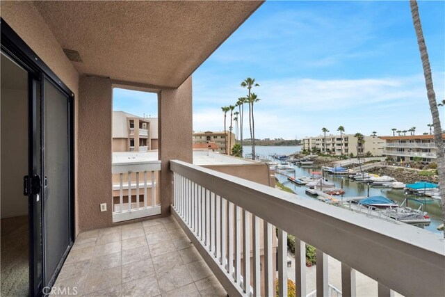 balcony featuring a water view