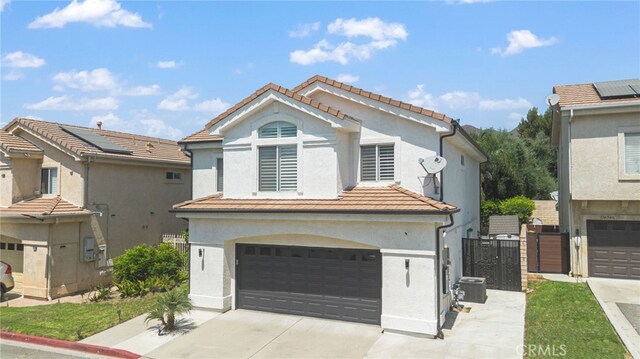 view of front of home with a garage and solar panels