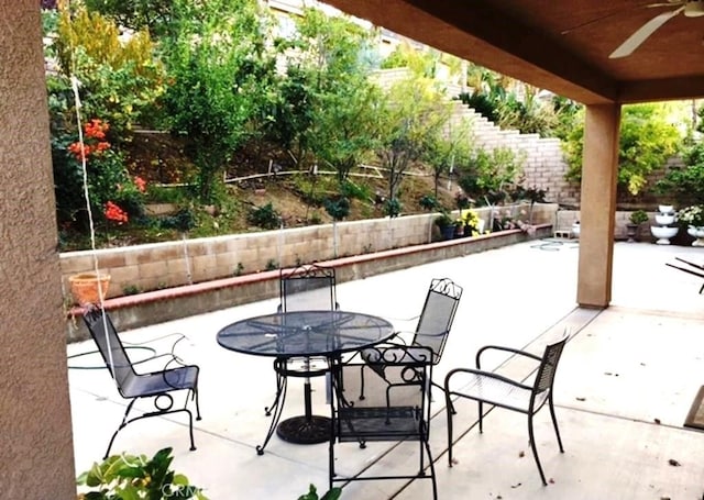 1638 Spyglass Dr, Corona, CA 92883 - fenced backyard with ceiling fan, a patio, and outdoor dining space
