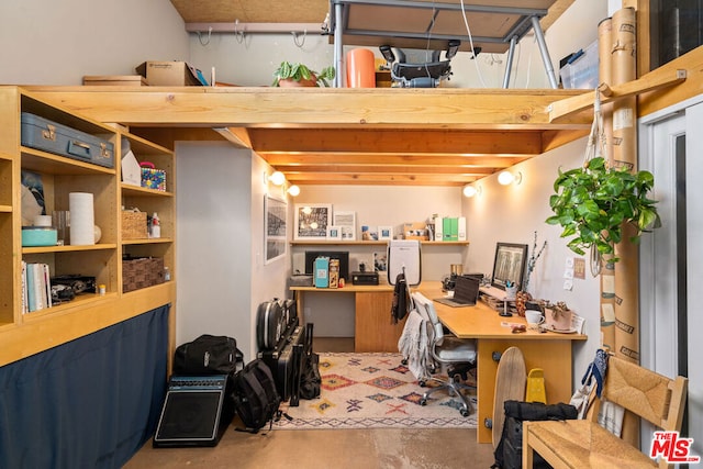 office area featuring concrete floors