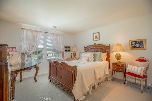 bedroom with light carpet