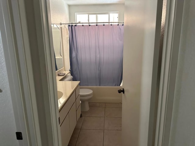 full bathroom with toilet, vanity, tile patterned flooring, and shower / bathtub combination with curtain