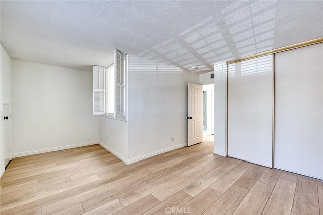 16090 Tortola Cir, Huntington Beach, CA 92649 - unfurnished bedroom with light wood finished floors and baseboards