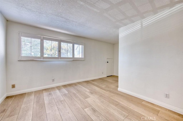 empty room with light wood-type flooring