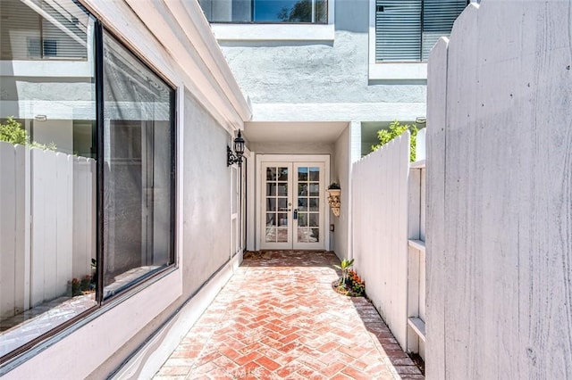 entrance to property featuring french doors