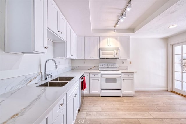 16090 Tortola Cir, Huntington Beach, CA 92649 - kitchen featuring white appliances, light wood-type flooring, white cabinets, light stone countertops, and track lighting