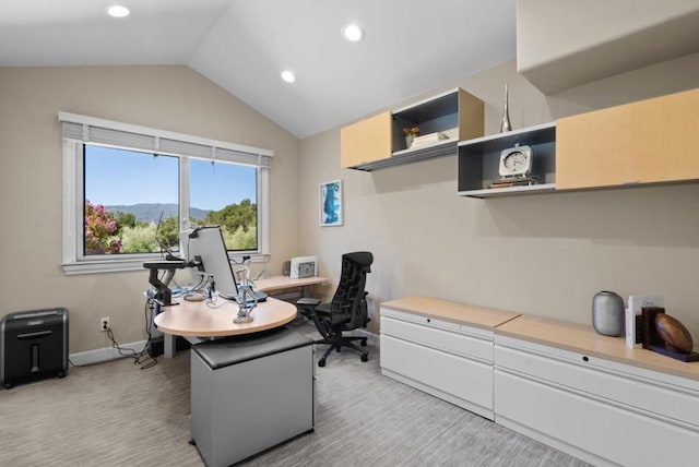 home office with lofted ceiling