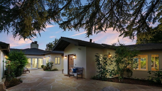 exterior space featuring french doors and a patio area