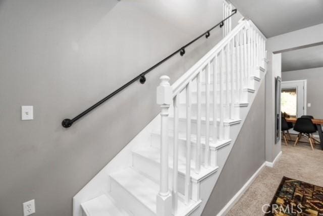 staircase with carpet floors