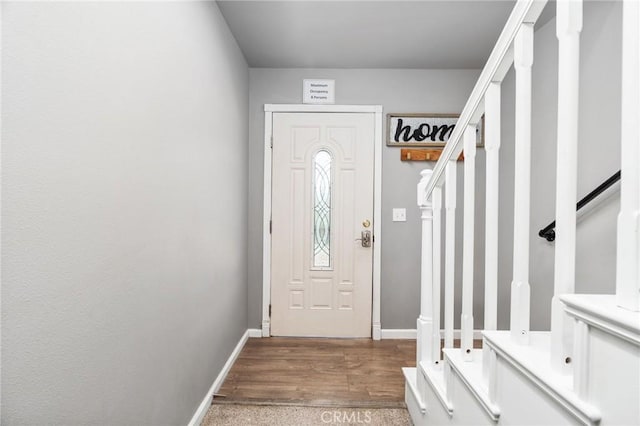 mudroom with dark hardwood / wood-style flooring