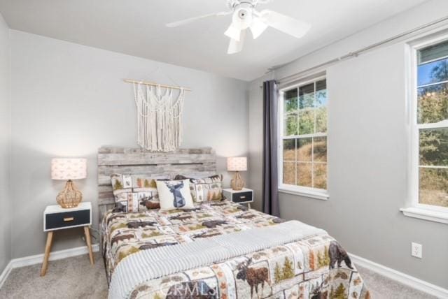 carpeted bedroom with ceiling fan