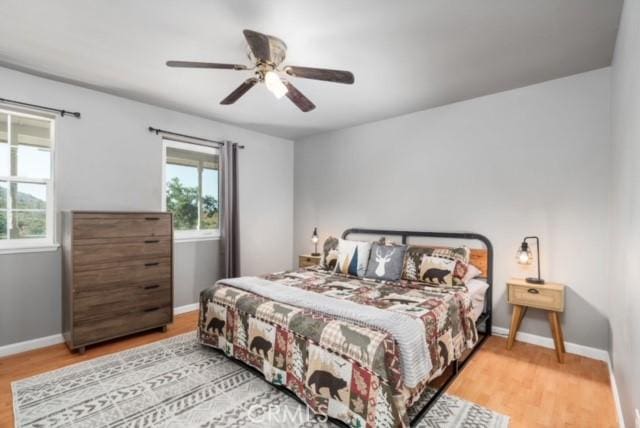 bedroom featuring light hardwood / wood-style flooring and ceiling fan