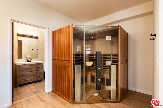 view of sauna featuring hardwood / wood-style flooring