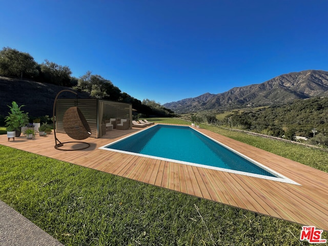 view of pool with a mountain view