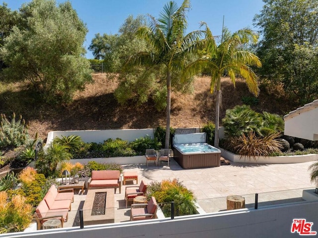 view of patio / terrace featuring an outdoor hangout area and a hot tub