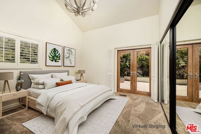 bedroom with access to outside, multiple windows, and french doors