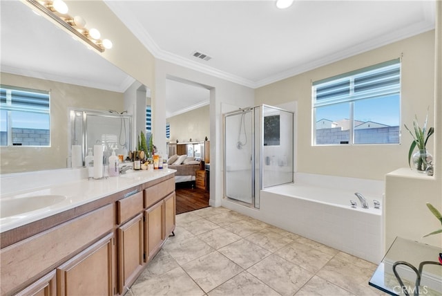 bathroom with crown molding, vanity, and independent shower and bath