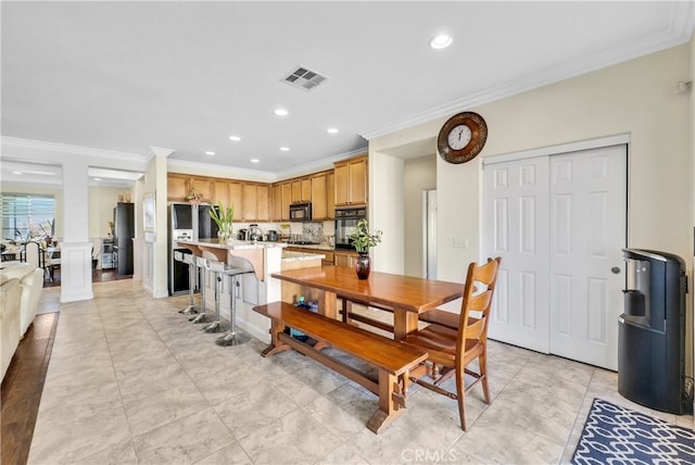 dining area with ornamental molding