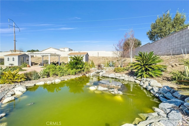 water view featuring a garden pond