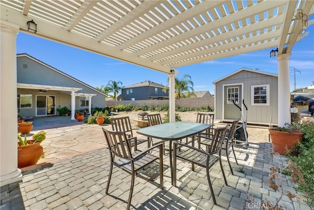 view of patio / terrace with a storage shed and a pergola