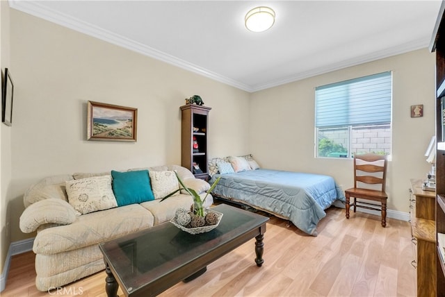 bedroom featuring ornamental molding and light wood-type flooring