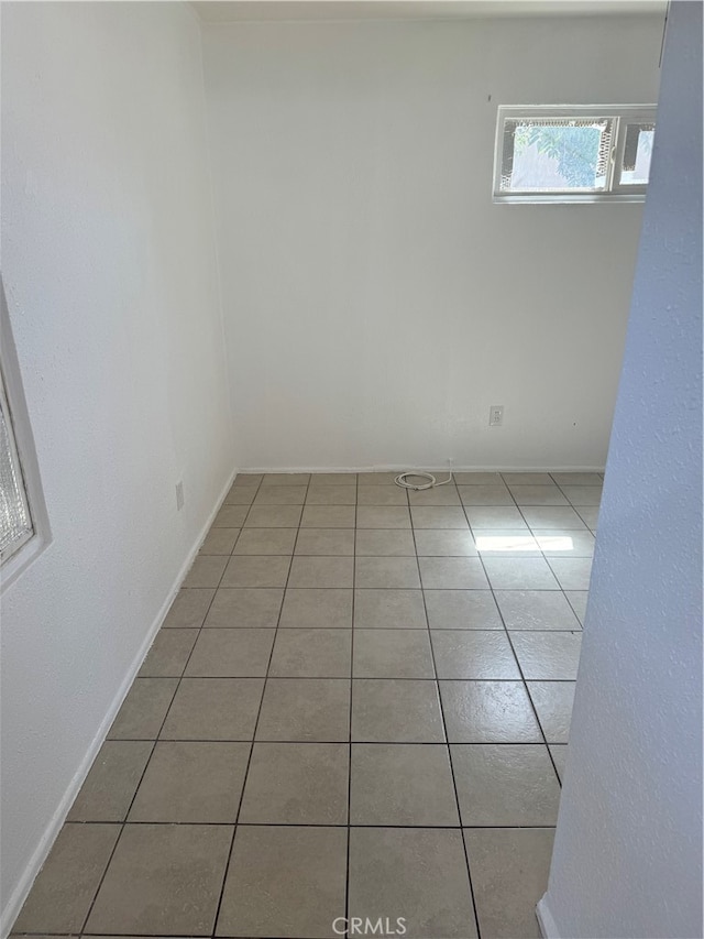 empty room featuring tile patterned floors