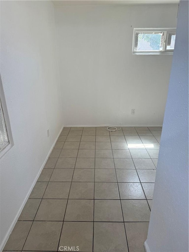 view of tiled spare room