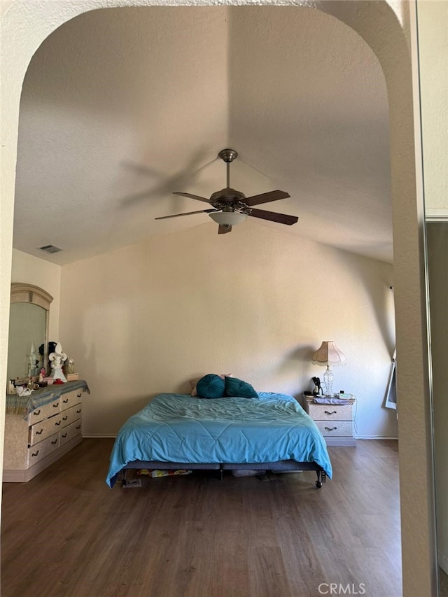 bedroom with ceiling fan and dark hardwood / wood-style floors