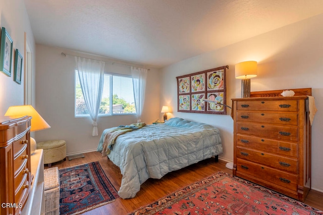 bedroom featuring wood-type flooring